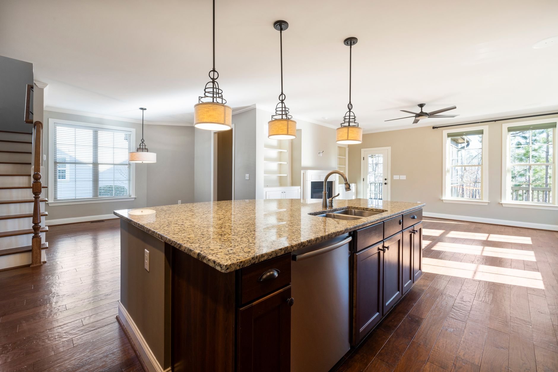 Warm, sunlit kitchen interior with natural stone countertop