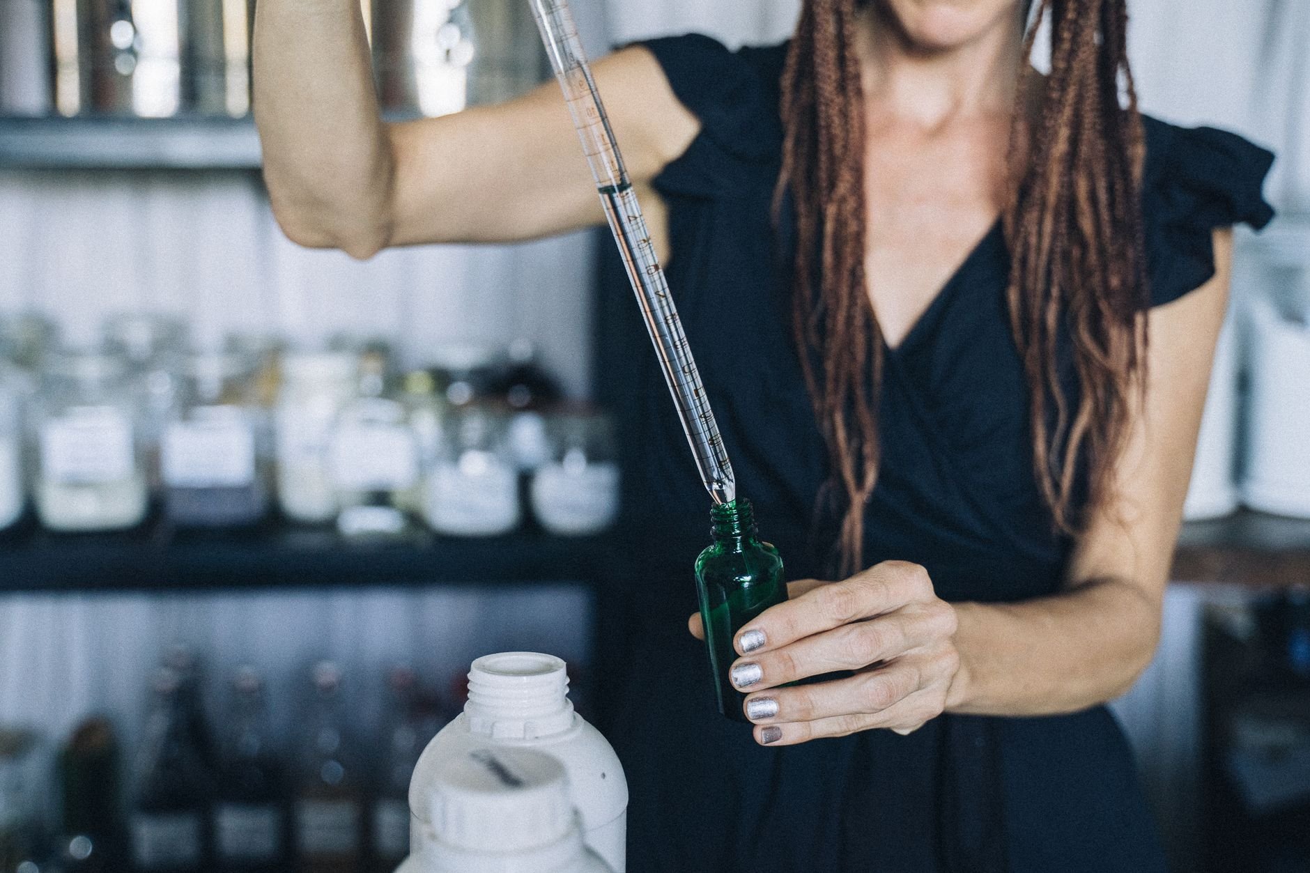 Person holding an eco-friendly glass refill bottle